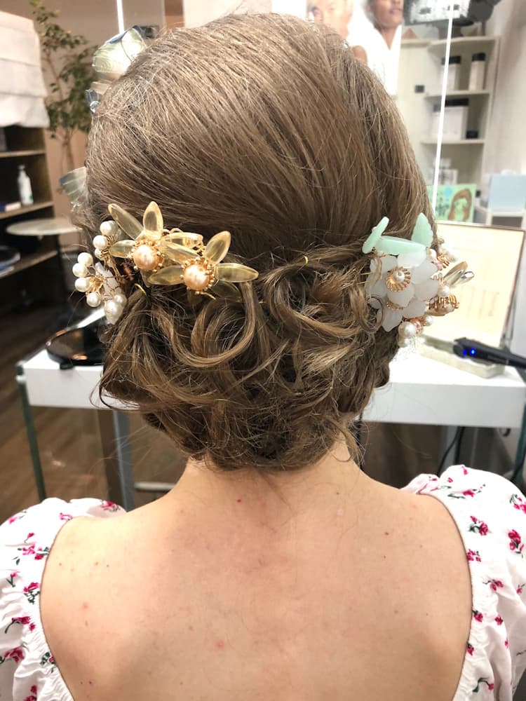 Back view of a woman with an elegant updo hairstyle
